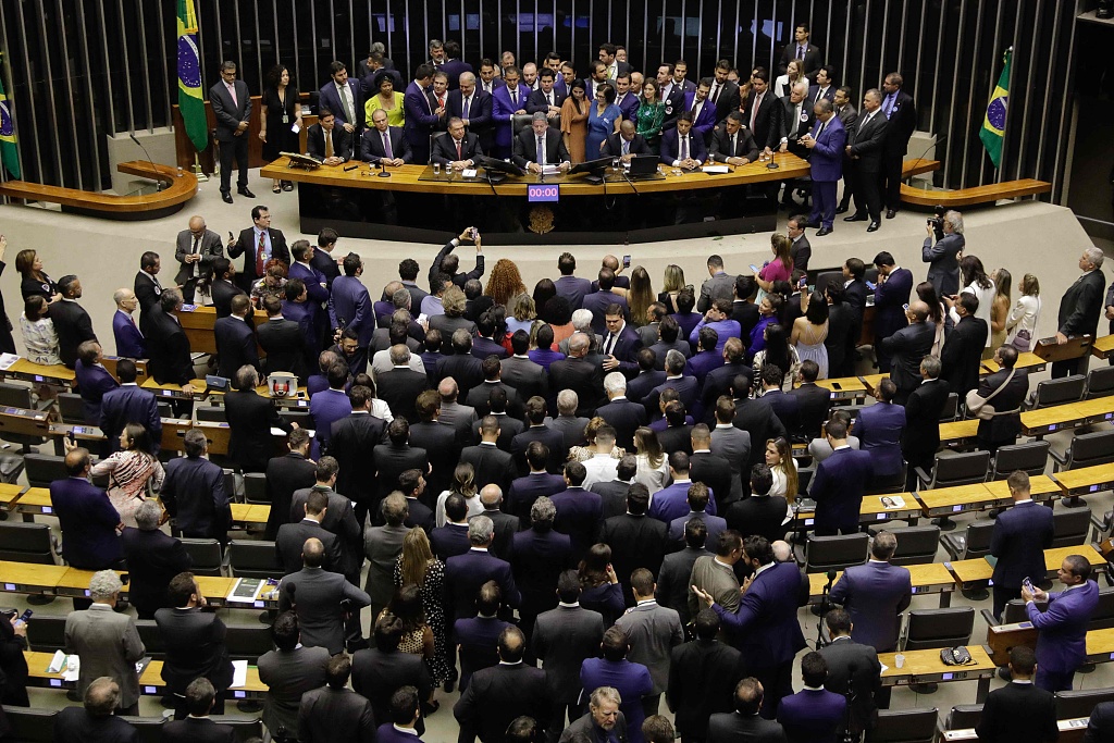 Brazilian lower house speaker Arthur Lira (C) speaks after being re-elected at the National Congress in Brasilia, Brazil, February 1, 2023. /CFP