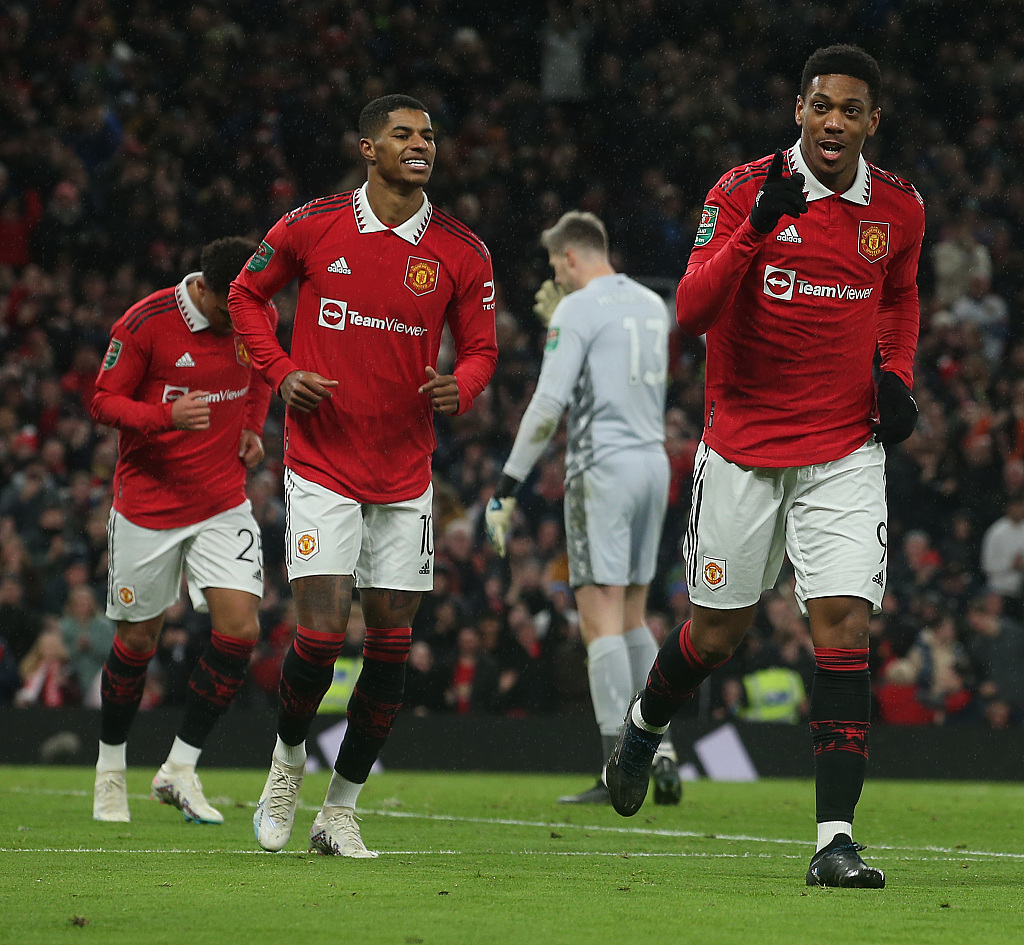 Manchester United's French striker Anthony Martial (R) celebrates after scoring their first goal against Nottingham Forest during the EFL semi-final second-leg match at Old Trafford in Manchester, UK, February 1, 2023. /CFP