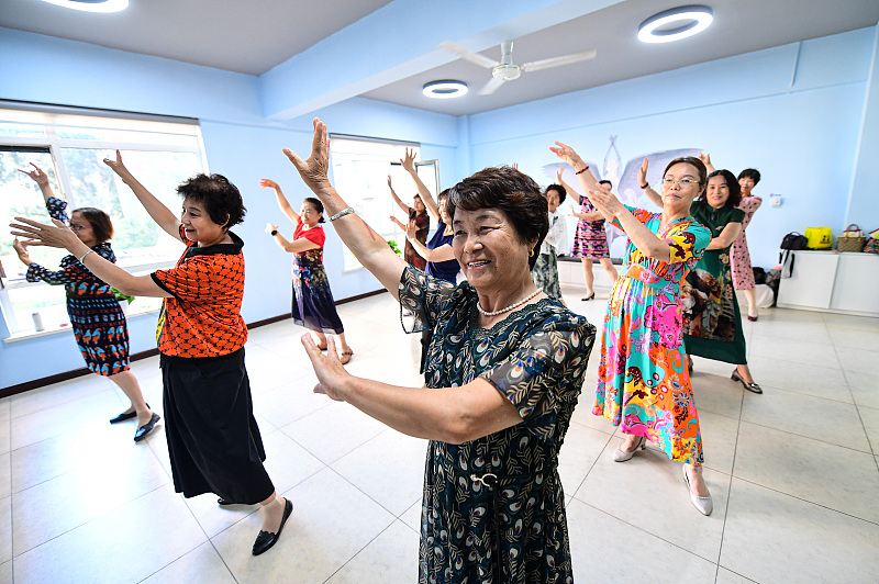 People dance at a activity center for the elderly in Tiexi District of Shenyang City, northeast China's Liaoning Province, August 25, 2022. /CFP