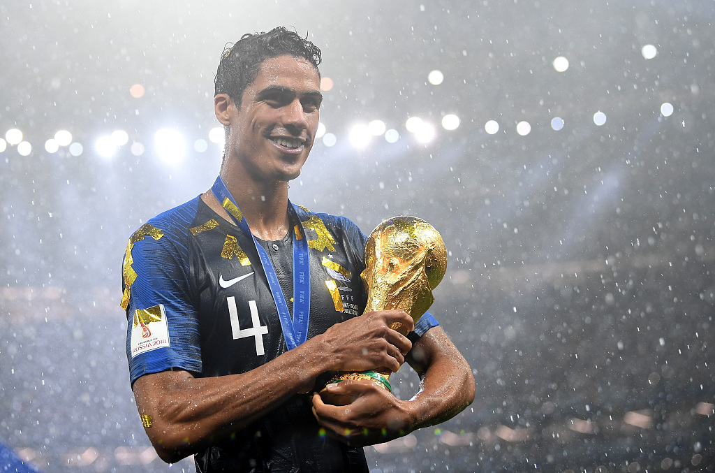 Raphael Varane of France holds the FIFA World Cup championship trophy after the 4-2 win over Croatia in the final at Luzhniki Stadium in Moscow, Russia, July 15, 2018. /CFP