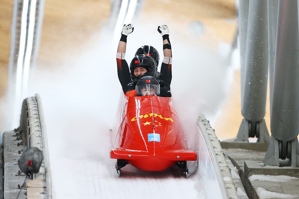 Team China athletes compete in the Beijing 2022 four-man bobsleigh event at the National Sliding Center in the competition zone of Yanqing, Beijing, China, February 20, 2022. /CFP