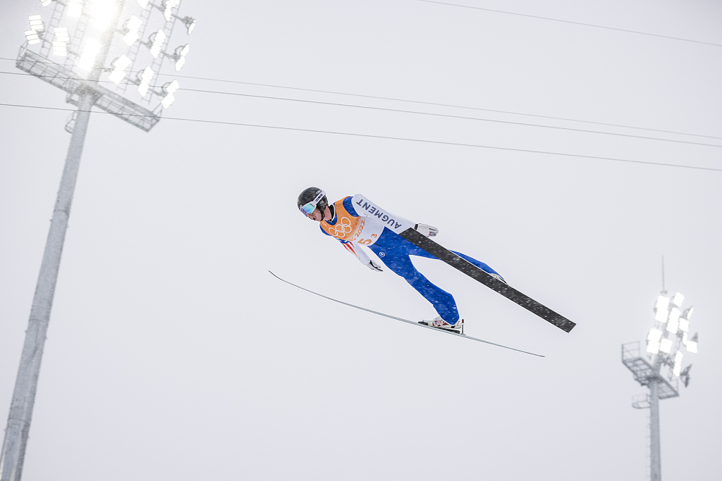 An athlete competes during the Beijing 2022 men's nordic combined ski jumping event at the National Cross-Country Skiing Center in Zhangjiakou, China, February 17, 2022. /CFP 