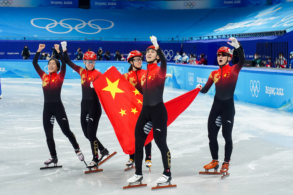 Team China athletes celebrate after winning the Beijing 2022 short-track speed skating mixed team relay final at the Capital Indoor Stadium in Beijing, China, February 5, 2022. /CFP