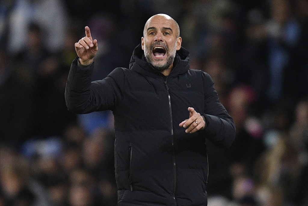 Pep Guardiola, manager of Manchester City, gives instructions to his players during the FA Cup game against Arsenal at the Etihad Stadium in Manchester, England, January 27, 2023. /CFP