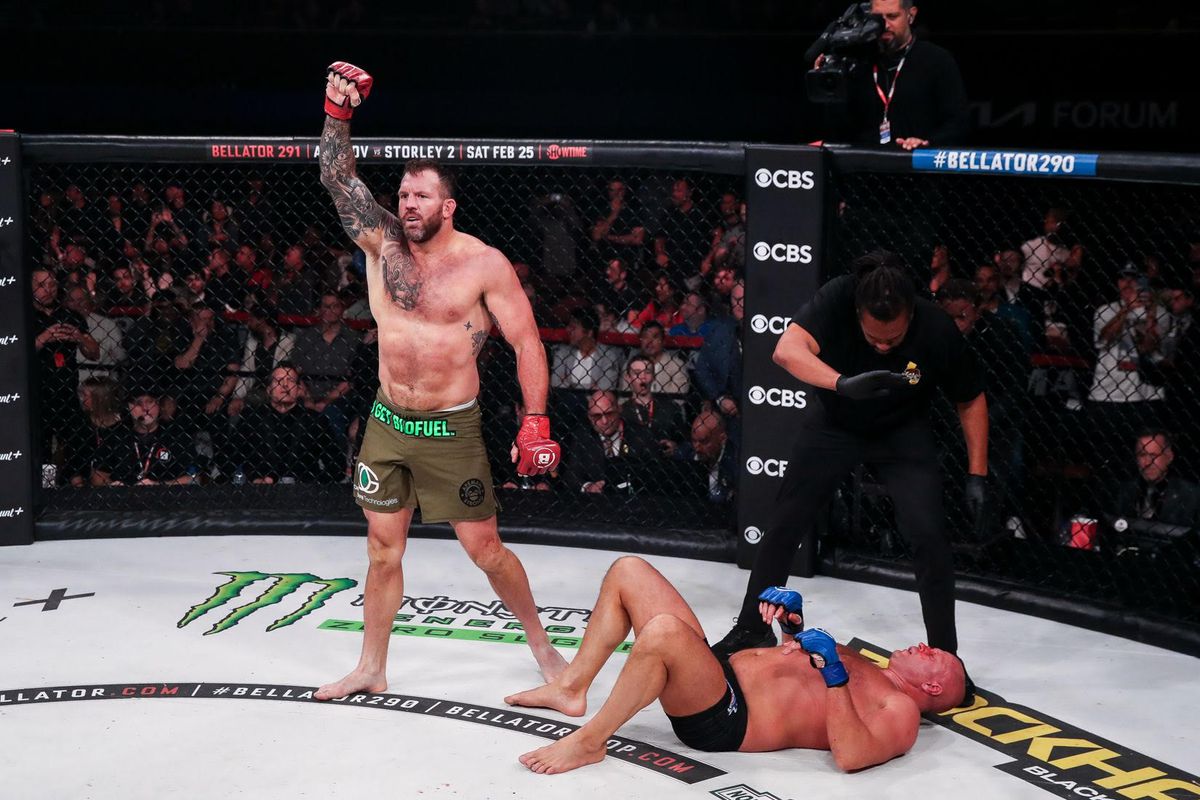Ryan Bader stands with his arm raised in victory following his TKO win over Fedor Emelianenko. /Bellator MMA