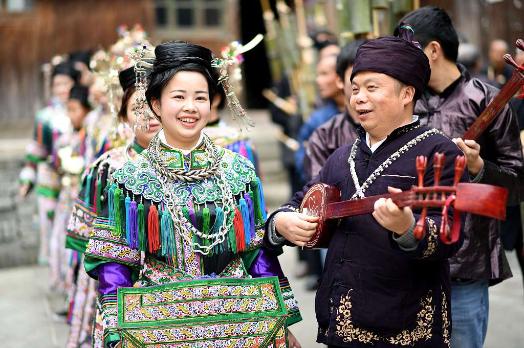 Dong people don ethnic costumes for a song-and-dance performance in Rongjiang County, Qiandongnan Miao and Dong Autonomous Prefecture, Guizhou Province. /CFP
