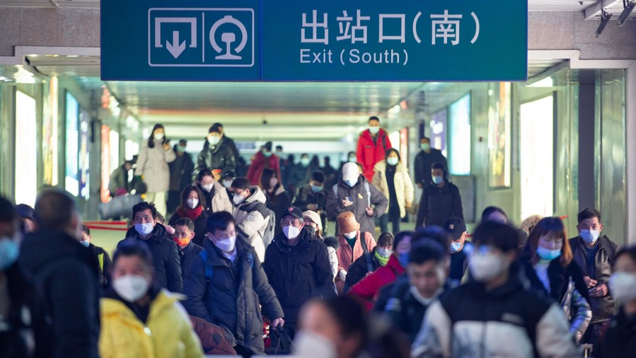 Travelers walk out of Nanjing Railway Station in Nanjing, capital of east China's Jiangsu Province, January 2, 2023. /Xinhua