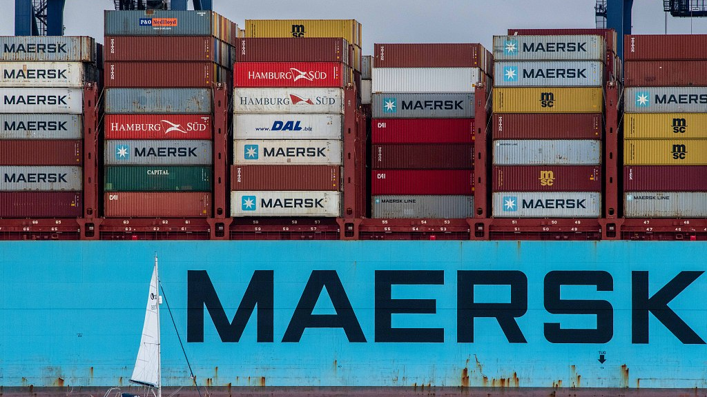 A sail boat passes a Maersk container ship at the Port of Felixstowe Ltd. in Felixstowe, United Kingdom, September 15, 2021. /CFP