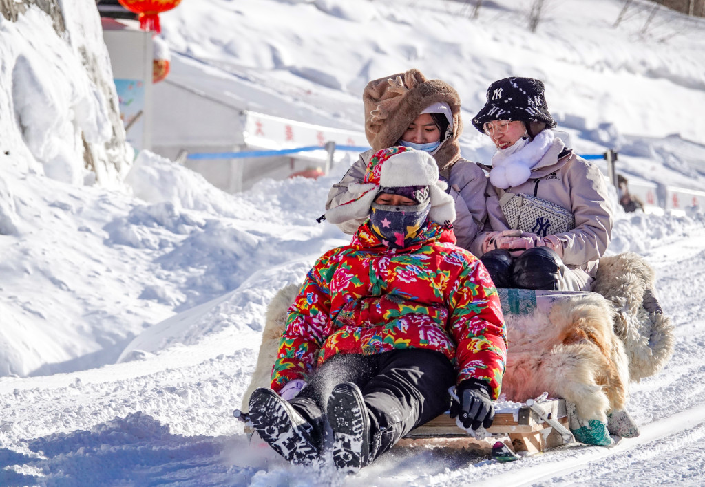 Tourists experience sledding in Baishan, Jilin Province. /CFP