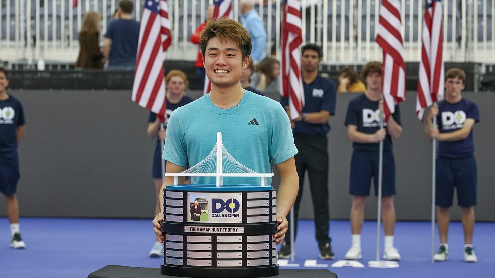 Wu Yibing poses with the Lamar Hunt Trophy after winning the Dallas Open at the Styslinger/Altec Tennis Complex in Dallas, U.S., February 12, 2023. /CFP