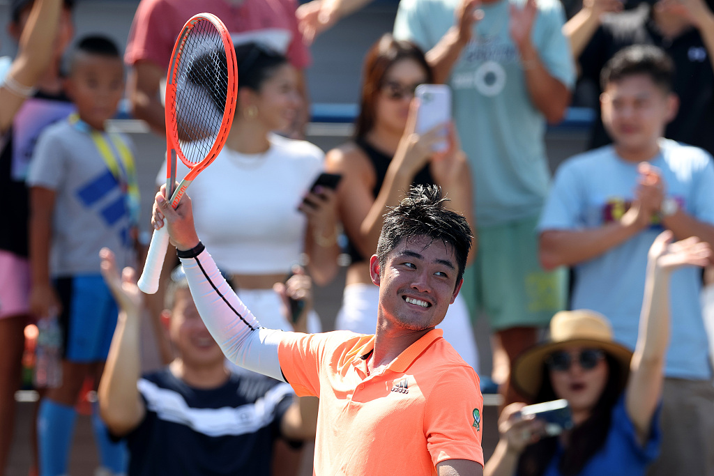 Wu Yibing celebrates after defeating Nikoloz Basilashvili during the men's singles first round of the U.S. Open at USTA Billie Jean King National Tennis Center in New York City, U.S., August 29, 2022. /CFP