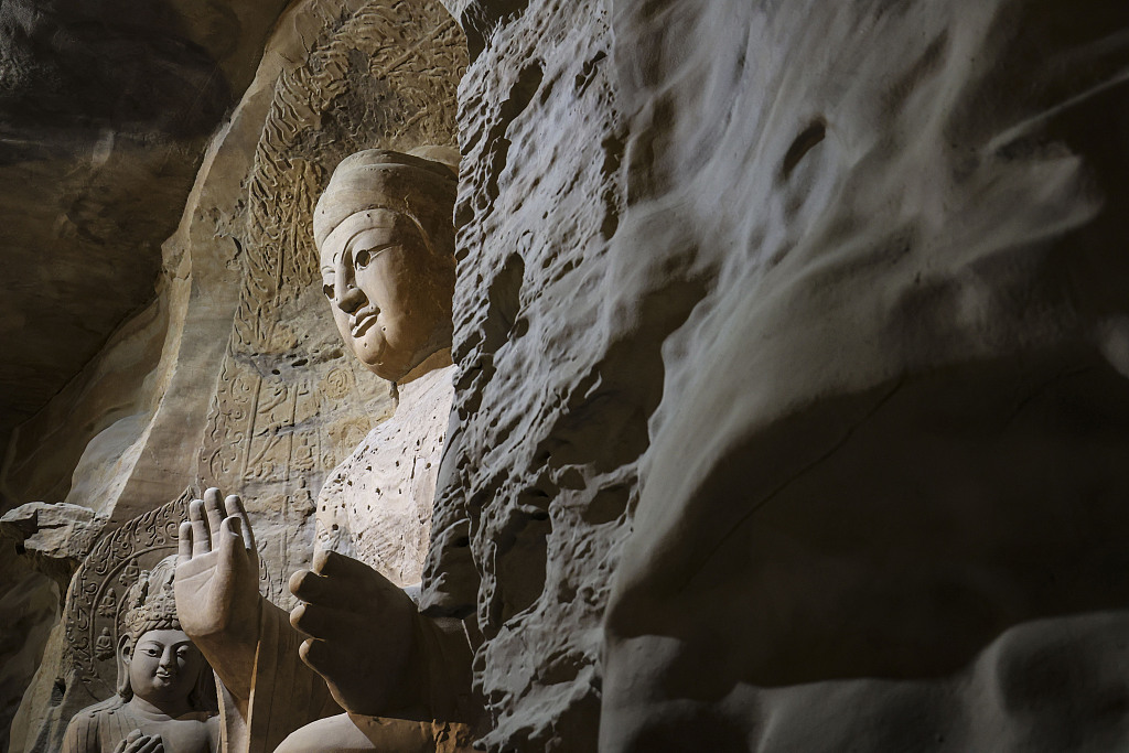 A 3D printed sculpture of the 9.93-meter Amitabha Buddha in Cave 3 of the Yungang Grottoes is seen at the Yungang Grottoes Art Museum in Qingdao, east China's Shandong Province, Feb 13, 2023. /CFP via Getty Image