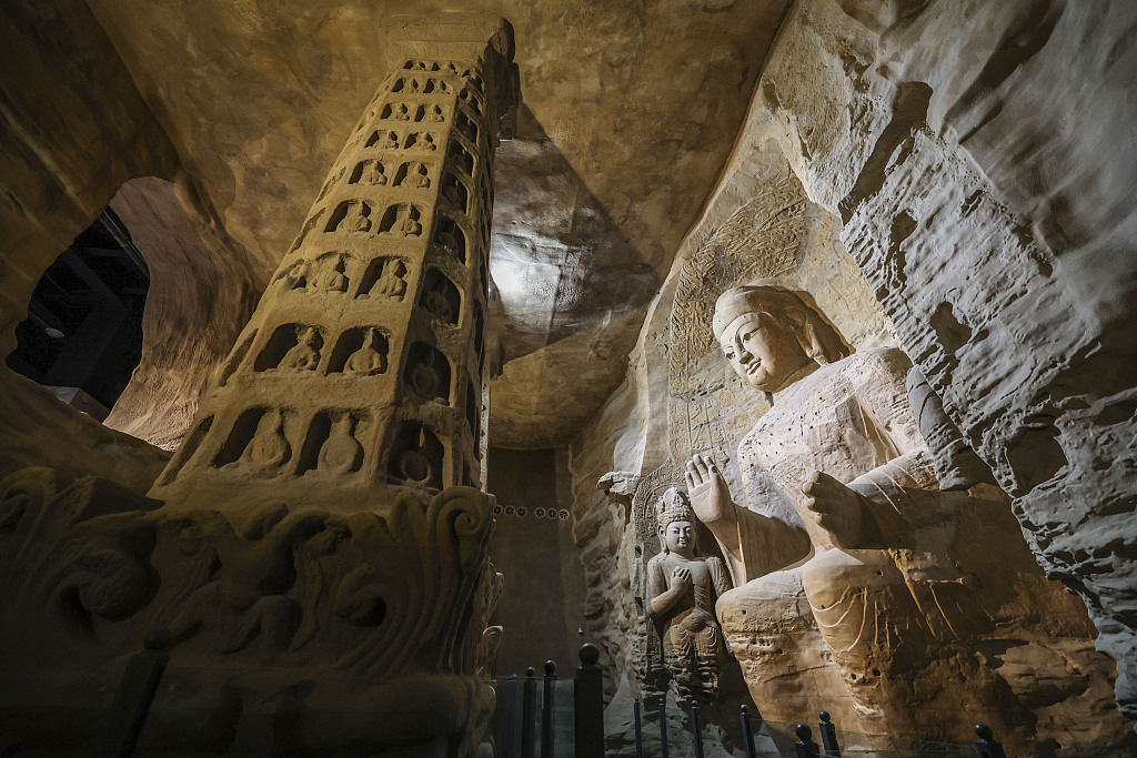A 3D printed sculpture of the 9.93-meter Amitabha Buddha in Cave 3 of the Yungang Grottoes is seen at the Yungang Grottoes Art Museum in Qingdao, east China's Shandong Province, Feb 13, 2023. /CFP via Getty Image
