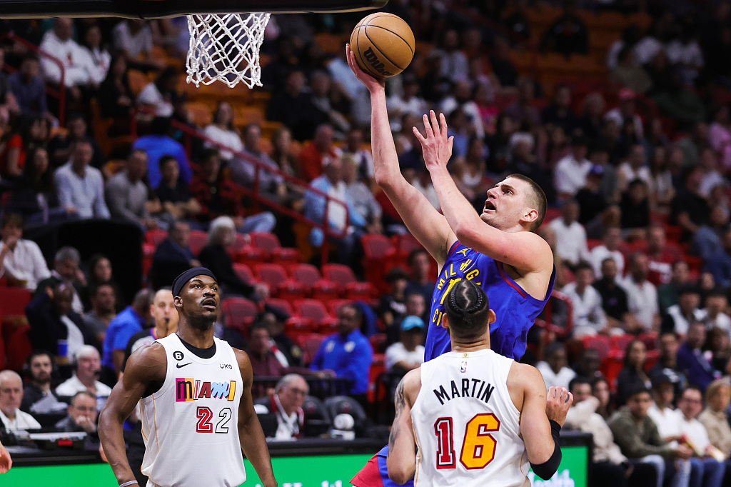 Nikola Jokic (C) of the Denver Nuggets shoots in the game against the Miami Heat at Miami-Dade Arena in Miami, Florida, February 13, 2023. /CFP