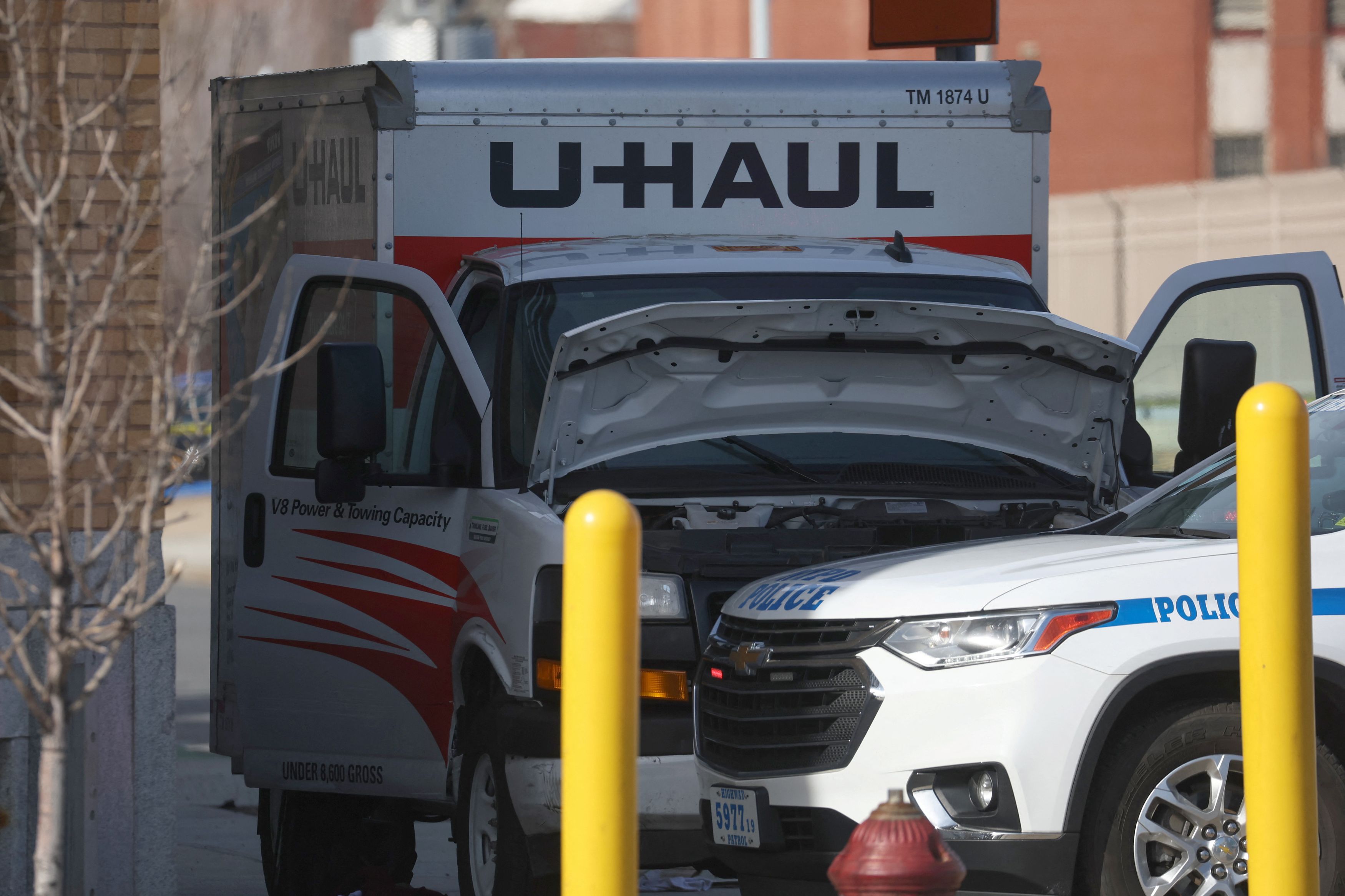 A New York Police Department vehicle blocks a U-Haul rental vehicle, where according to media reports a man struck multiple people and the NYPD took the driver into custody, near the Battery tunnel in the Brooklyn borough of New York City, U.S., February 13, 2023. /Reuters