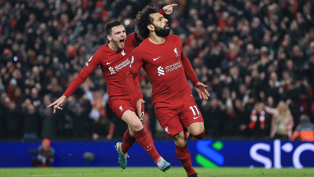 Mohamed Salah (R) of Liverpool and teammate Andy Robertson celebrate during their clash with Everton at Anfield in Liverpool, England, February 13, 2023. /CFP