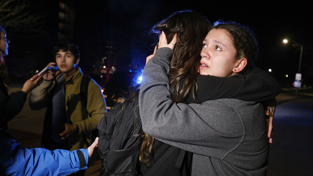 Michigan State University students hug during an active shooter situation on campus in East Lansing, Michigan, February 13, 2023. /CFP