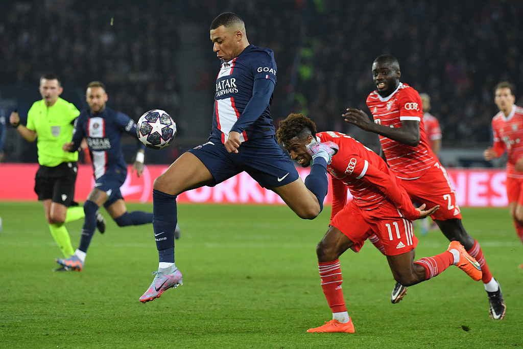 Kylian Mbappe (C) of Paris Saint-Germain competes for the ball in the UEFA Champions League Round of 16 second-leg game against Bayern Munich at the Parc des Princes in Paris, France, February 14, 2023. /CFP