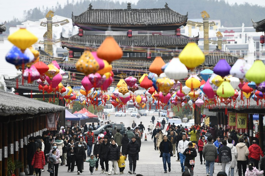 People tour Jiuzhou ancient town in Huangping County, southwest China's Guizhou Province, January 26, 2023. /Xinhua