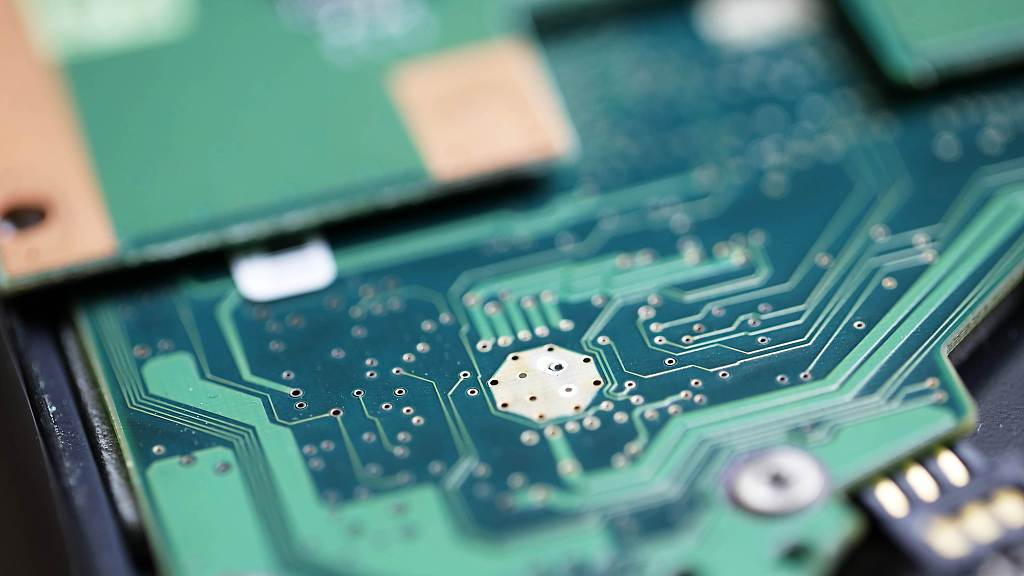 A close-up view of circuit boards and semiconductor chips. /CFP