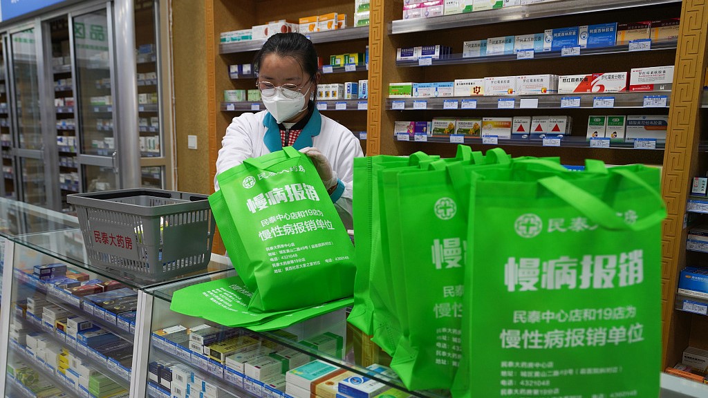 An employee of a drug store packs medicines for delivery in Zouping, east China's Shandong Province, February 12, 2023. /CFP