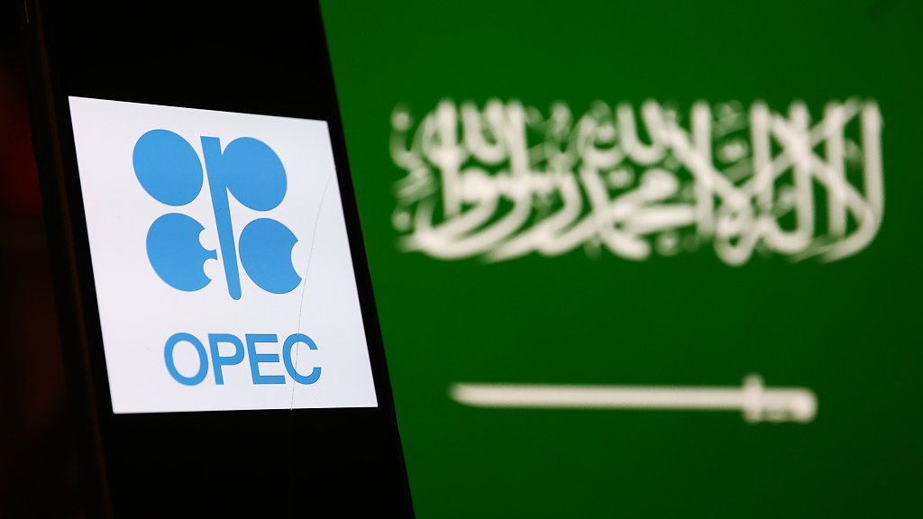 OPEC logo displays on a phone screen and Saudi Arabian flag displays on a screen in the background are seen in this illustration photo taken in Poland on October 6, 2022. /CFP