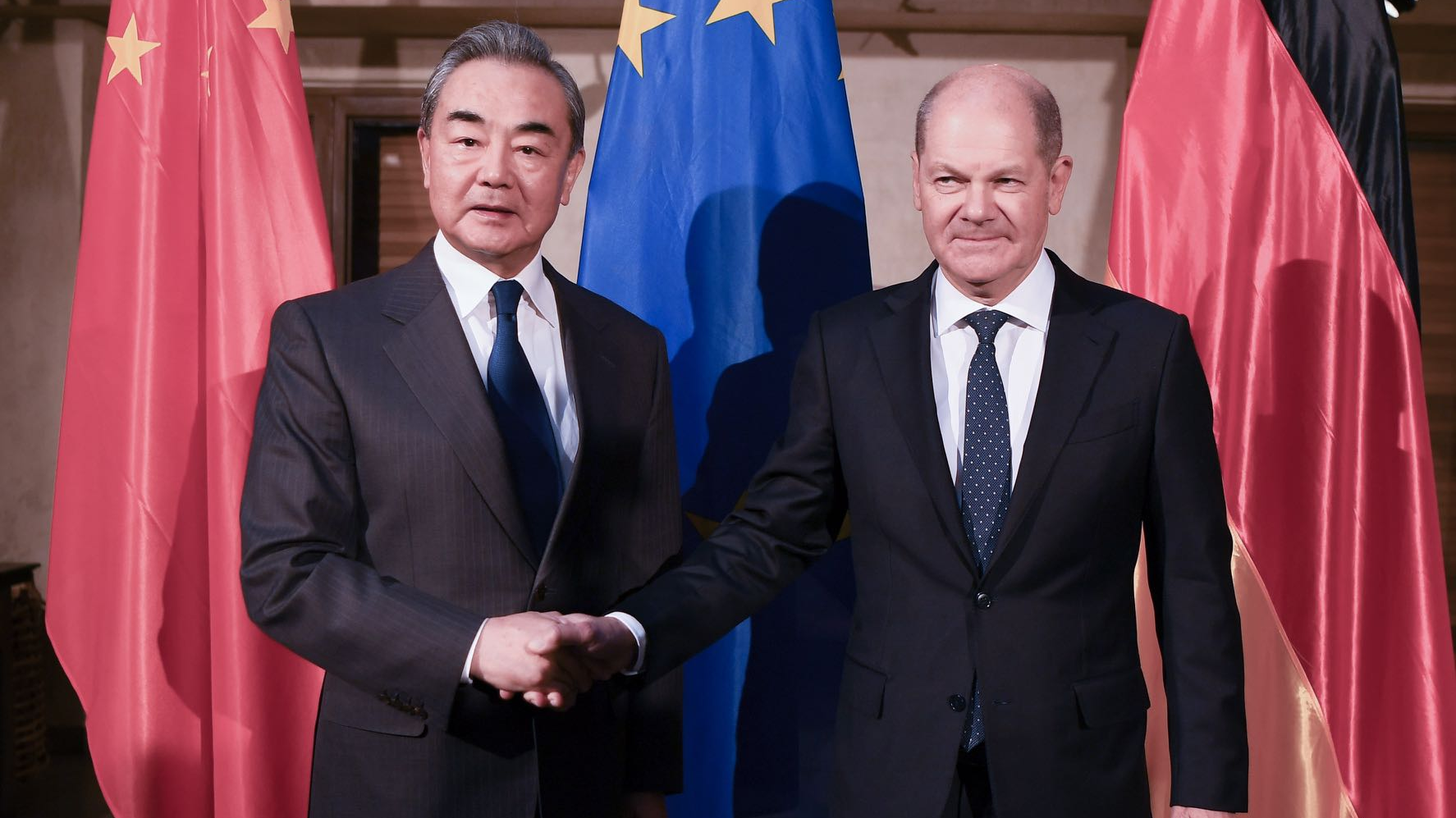 Wang Yi (L) meets with German Chancellor Olaf Scholz in Munich, Germany, February 17, 2023. /CMG