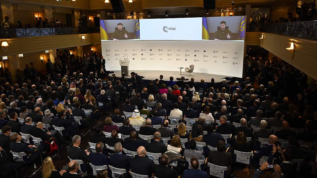 Participants watch Ukrainian President Volodymyr Zelenskyy on a screen during the Munich Security Conference in Munich, southern Germany, February 17, 2023. /CFP