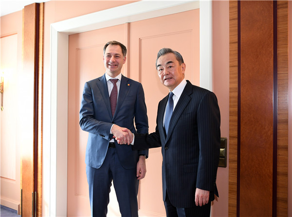 Wang Yi (R), a member of the Political Bureau of the CPC Central Committee and director of the Office of the Foreign Affairs Commission of the CPC Central Committee, shakes hands with Belgian Prime Minister Alexander De Croo in Munich, Germany, February 18, 2023. /Chinese Foreign Ministry