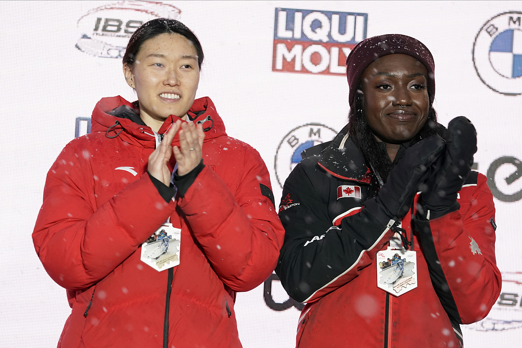 Ying Qing (L) of China and Appiah Cynthia of Canada on the podium during the IBSF World Cup in Sigulda, Latvia, February 18, 2023. /CFP