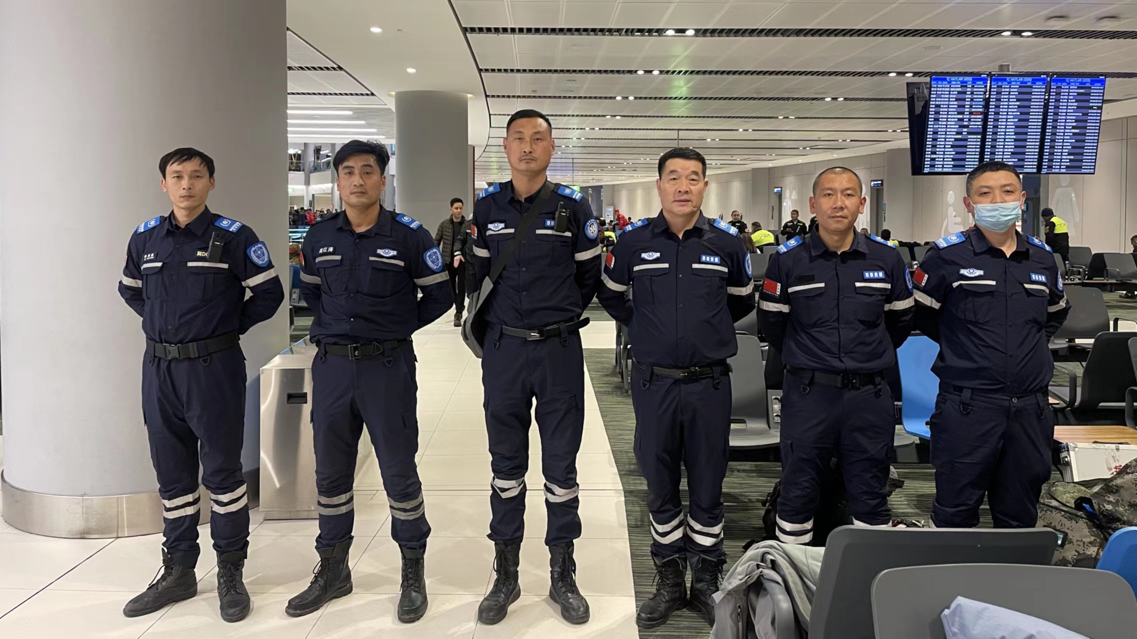Xu Yingqiang (L1) and other teammates wait at an airport in Istanbul, Türkiye, February 11, 2023. /Courtesy of Xu Yingqiang