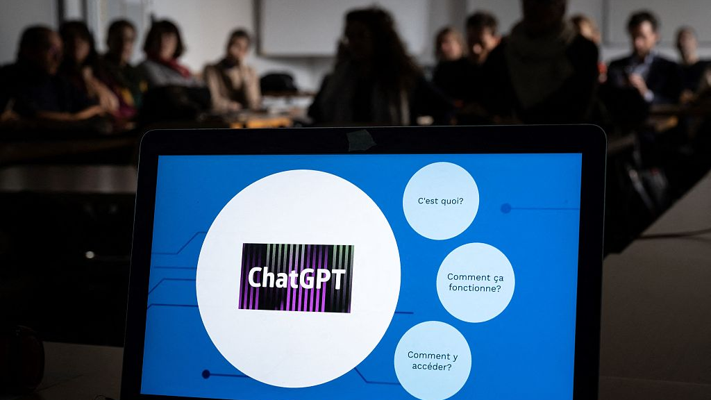 Staff members are seen behind a laptop during a workshop on ChatGPT bot organized for by the School Media Service (SEM) of the Public education of the Swiss canton of Geneva, February 1, 2023. /CFP