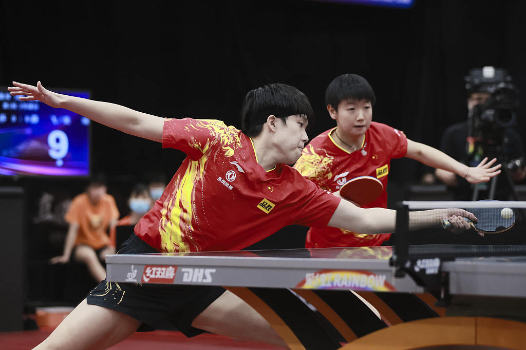 Wang Chuqin (L) and Sun Yingsha compete during the mixed doubles' match in domestic trials to contend for berths at 2023 ITTF World Table Tennis Championships Finals in Beijing, China, February 19, 2023. /CFP