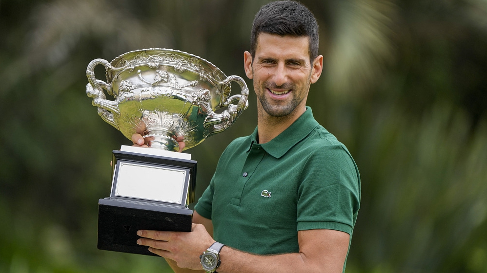 Novak Djokovic poses with the trophy after winning the men's singles final at the Australian Open in Melbourne, Australia, January 30, 2023. /CFP