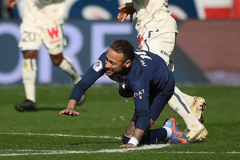 PSG striker Neymar falls down after a tackle from Lille's French midfielder Benjamin Andre during their Ligue 1 clash at Parc des Princes in Paris, France, February 19, 2023. /CFP