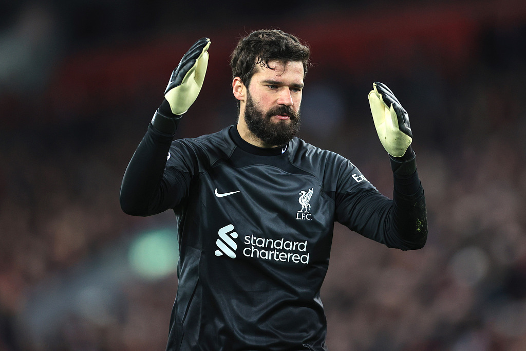 Alisson Becker, Liverpool's goalkeeper, reacts after allowing a goal in the first-leg game of the UEFA Champions League Round of 16 competitions against Real Madrid at Anfield in Liverpool, England, February 21, 2023. /CFP