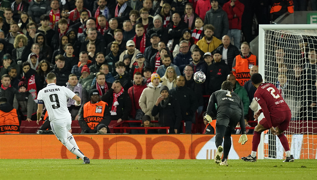 Karim Benzema (L) of Real Madrid scores a goal against Liverpool during their Champions League match at Anfield in Liverpool, England, February 21, 2023. /CFP