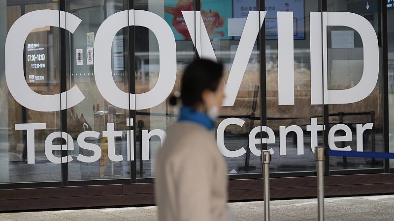 A woman walks outside of a COVID-19 testing center at the Incheon International Airport In Incheon, South Korea, Febuary 10, 2023. /CFP