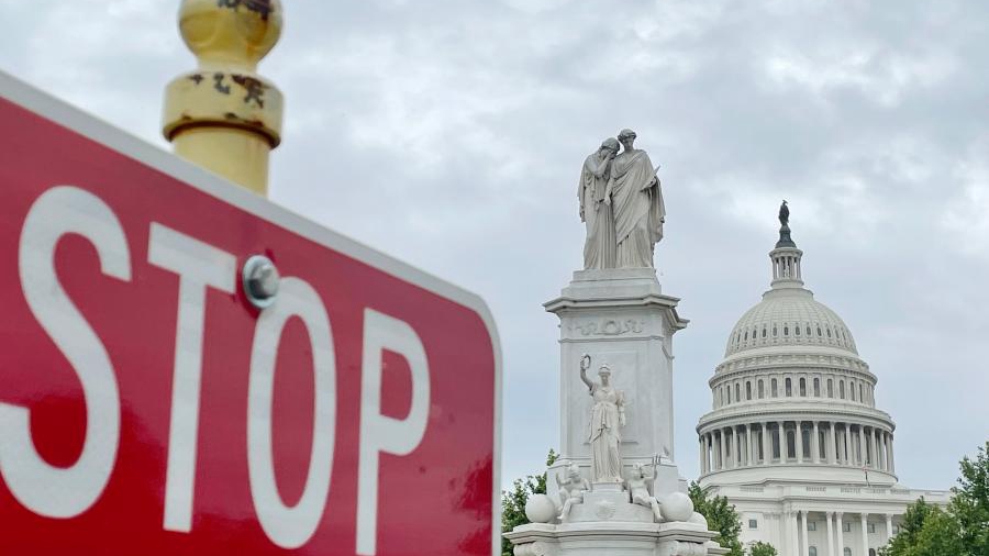 The U.S. Capitol building sits in the background of a traffic sign in Washington, D.C., the U.S., May 28, 2021. /Xinhua