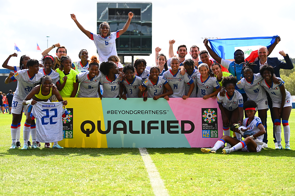 Haitian players celebrate for their qualification for the 2023 FIFA Women's World Cup after their victory in the playoff against Chile in Auckland, New Zealand, February 22, 2023. /CFP