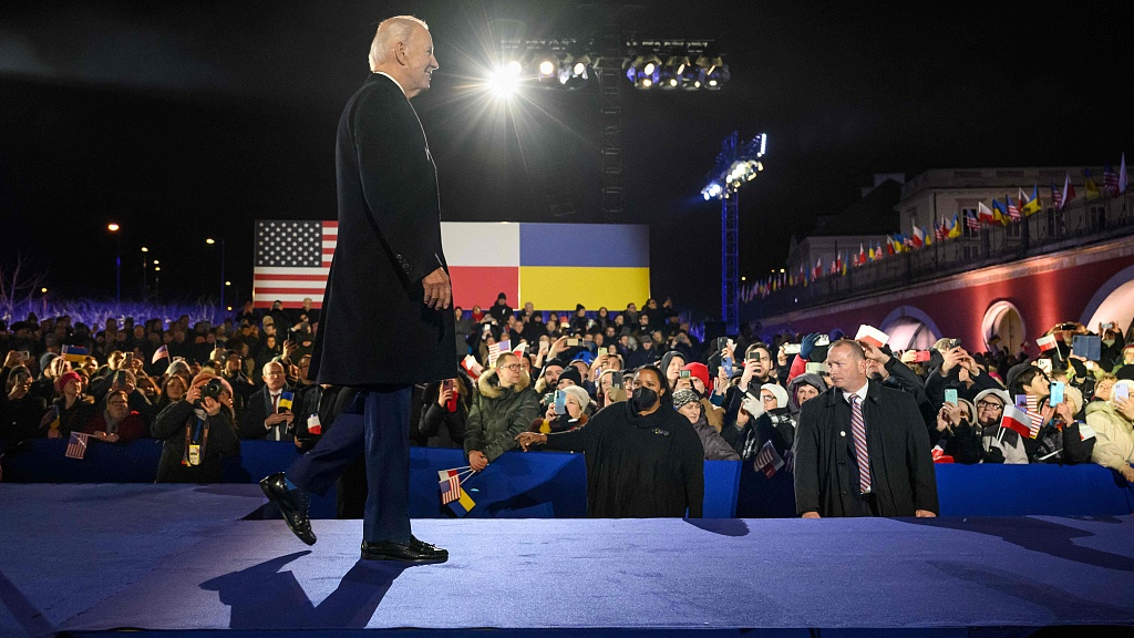 U.S. President Joe Biden walks on the stage after speaking at the Royal Warsaw Castle Gardens in Warsaw, Poland, February 21, 2023. /CFP