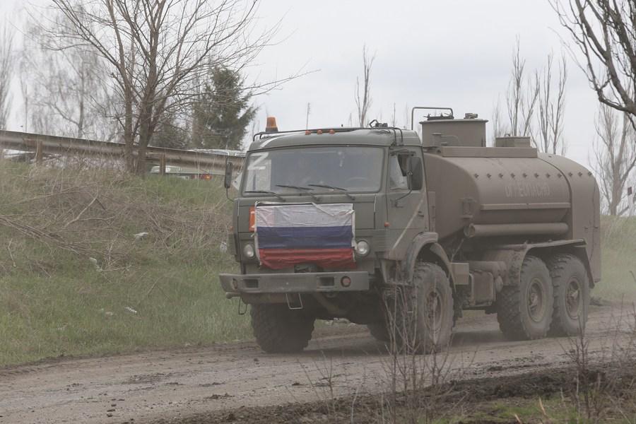 An army vehicle runs on a road near Mariupol on April 17, 2022. /Xinhua