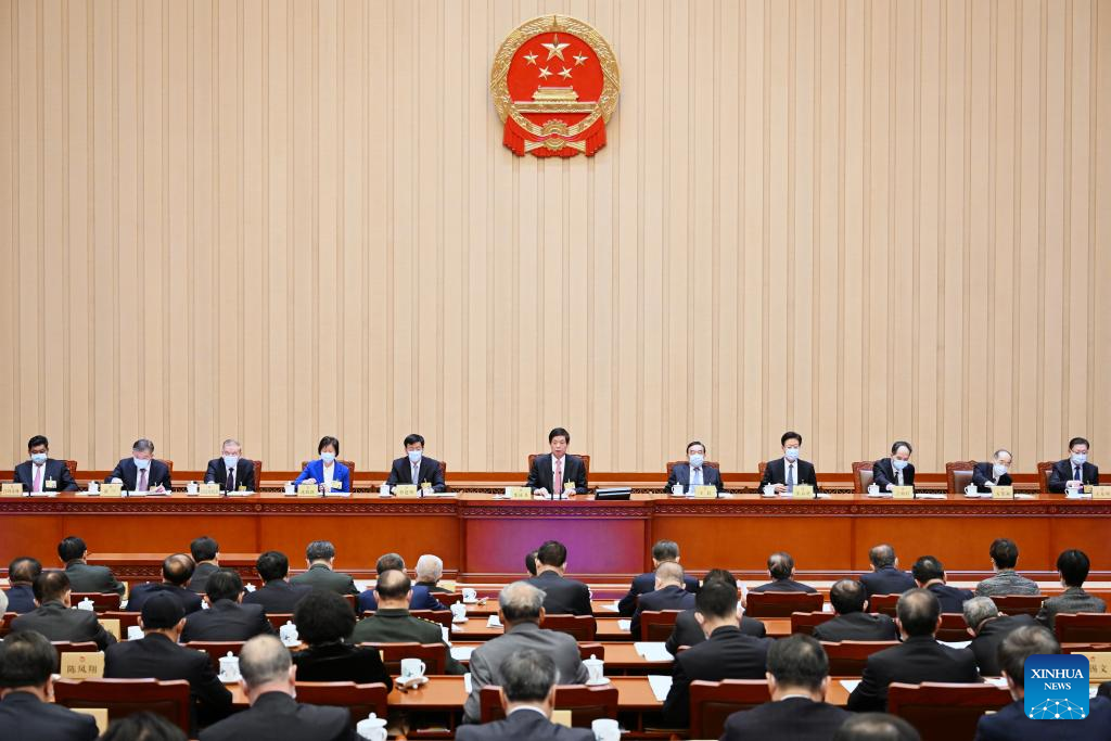 Li Zhanshu (C), chairman of the National People's Congress (NPC) Standing Committee, presides over the closing meeting of the 39th session of the 13th NPC Standing Committee at the Great Hall of the People in Beijing, China, February 24, 2023. /Xinhua