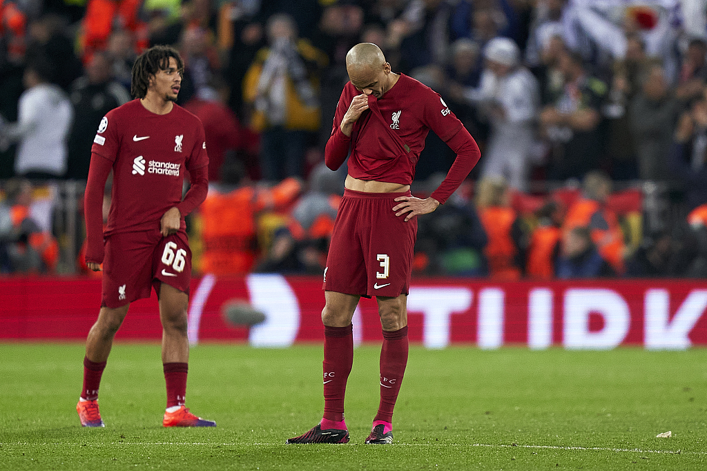 Fabinho (R) and Trent Alexander-Arnold of Liverpool look on after the 5-2 loss to Real Madrid in the first-leg game of the UEFA Champions League Round of 16 competitions at Anfield in Liverpool, England, February 21, 2023. /CFP