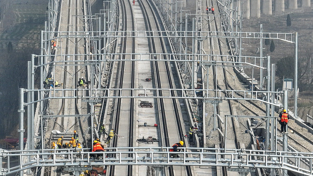 Workers conduct track fine-tuning and electrification construction on the section of the Huzhou-Hangzhou Railway in Wuxing District, Huzhou City, Zhejiang Province, February 28, 2022. /CFP