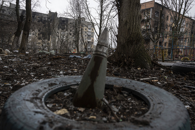 A part of a rocket sticks from a ground in the frontline city of Vuhledar, Ukraine, February 25, 2023. /CFP