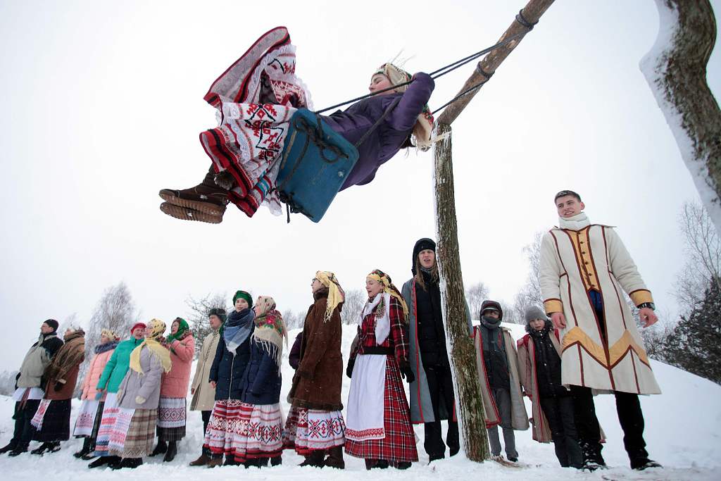 A woman swings as people celebrate the Maslenitsa festival in the village of Krevo, some 100km northwest of Minsk, on Feb. 17, 2018. /CFP
