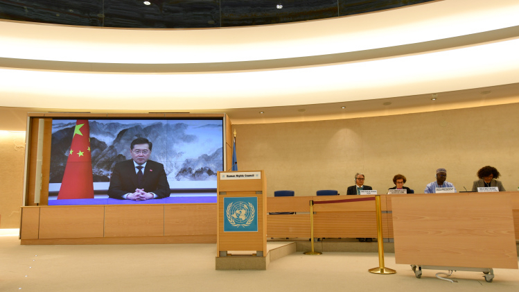 Chinese Foreign Minister Qin Gang (on screen) addresses a high-level segment of the 52nd session of the UN Human Rights Council via video link in Geneva, Switzerland, February 27, 2023. /Xinhua