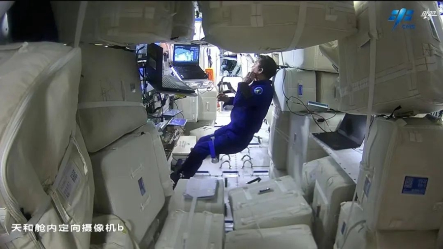 Deng Qingming stays inside the space station to support the spacewalk by his crewmates, March 2, 2023. /CMS