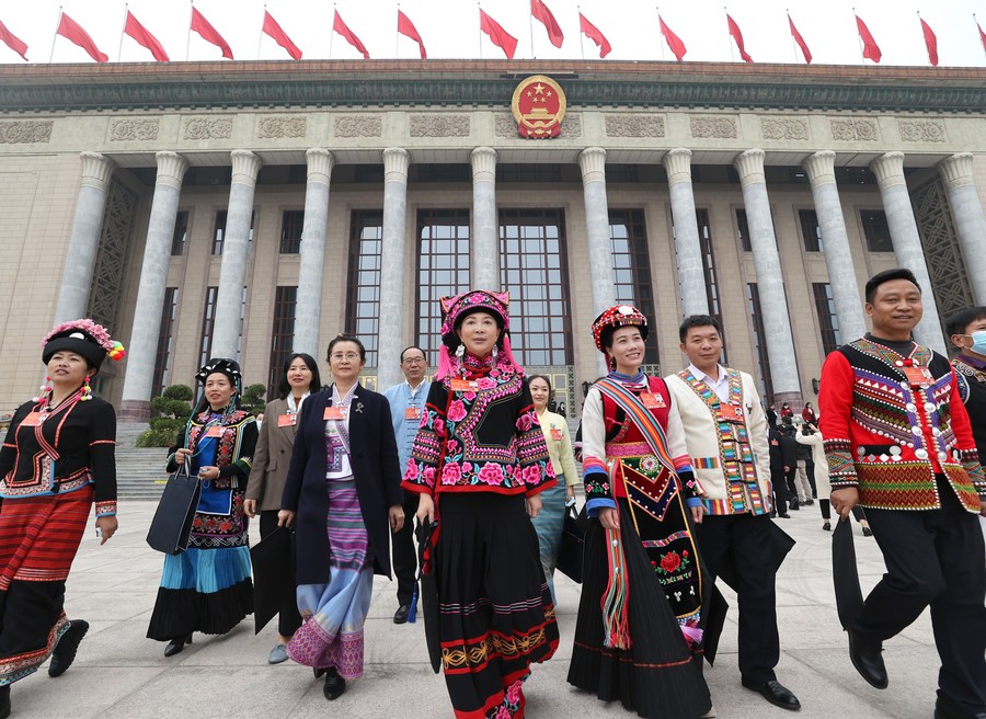 Deputies to the 13th National People's Congress leave the Great Hall of the People after the closing meeting of the fifth session of the 13th NPC in Beijing, capital of China, March 11, 2022. /Xinhua